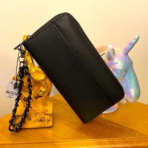 Black wallet/wristlet from Ardene. Measures 7.5in x 4in